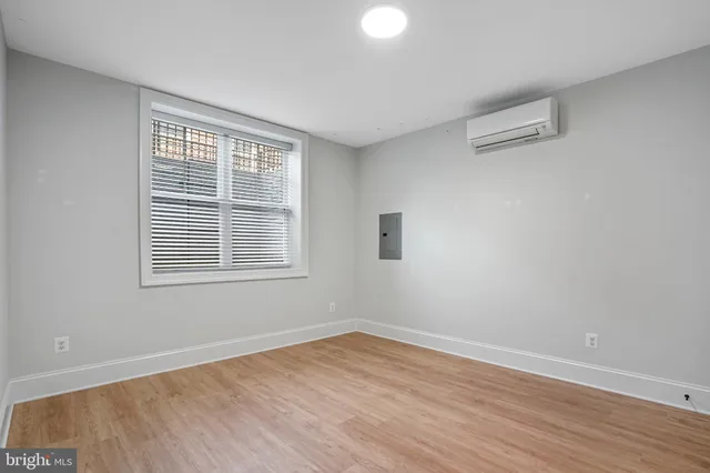a bathroom with a sink toilet vanity and shower