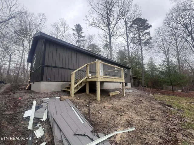 a house with trees in the background
