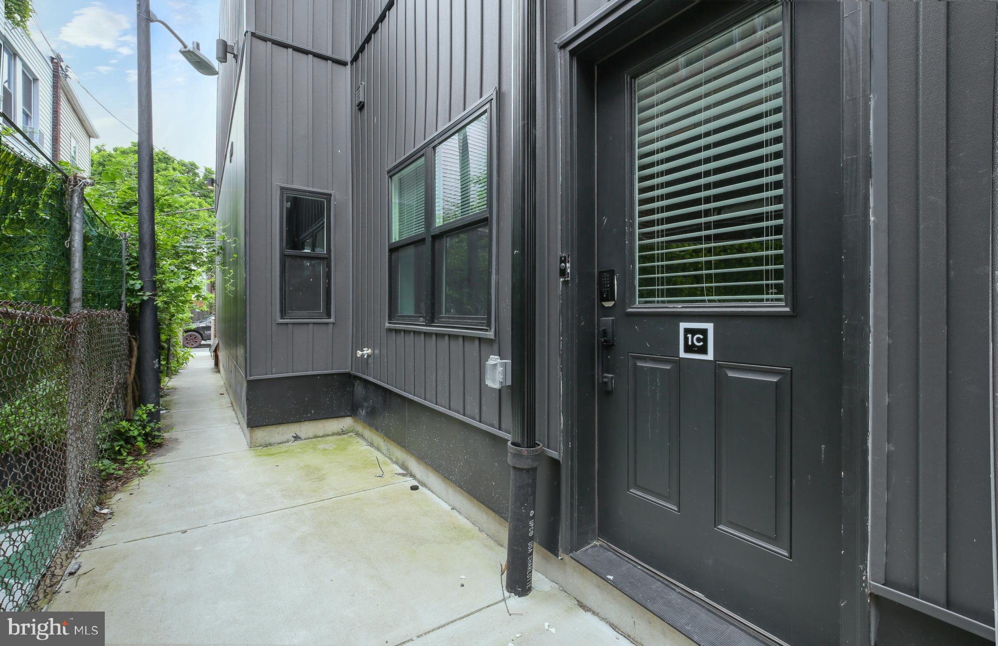 5007 Pentridge Street, Unit 1C Philadelphia, PA 19143 - Photo 12 of 14 a view of house with backyard and glass windows