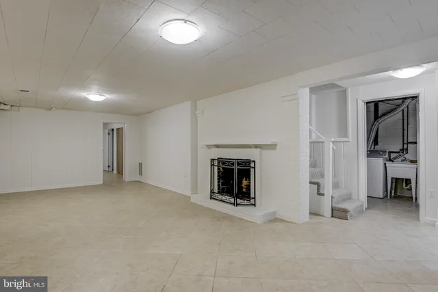 an empty room with a fireplace