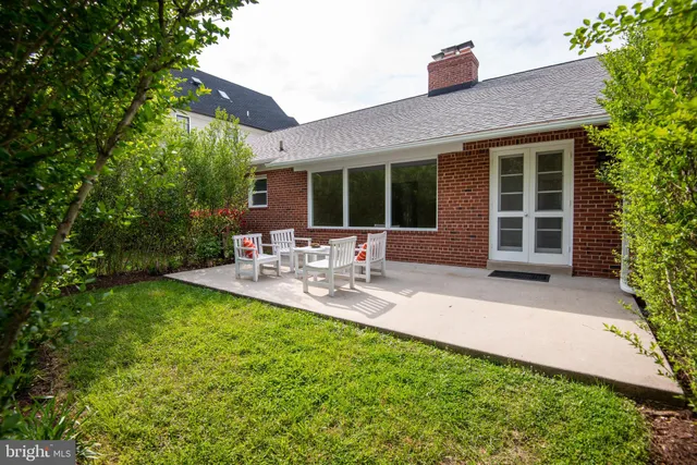 a view of a table and chairs in the garden