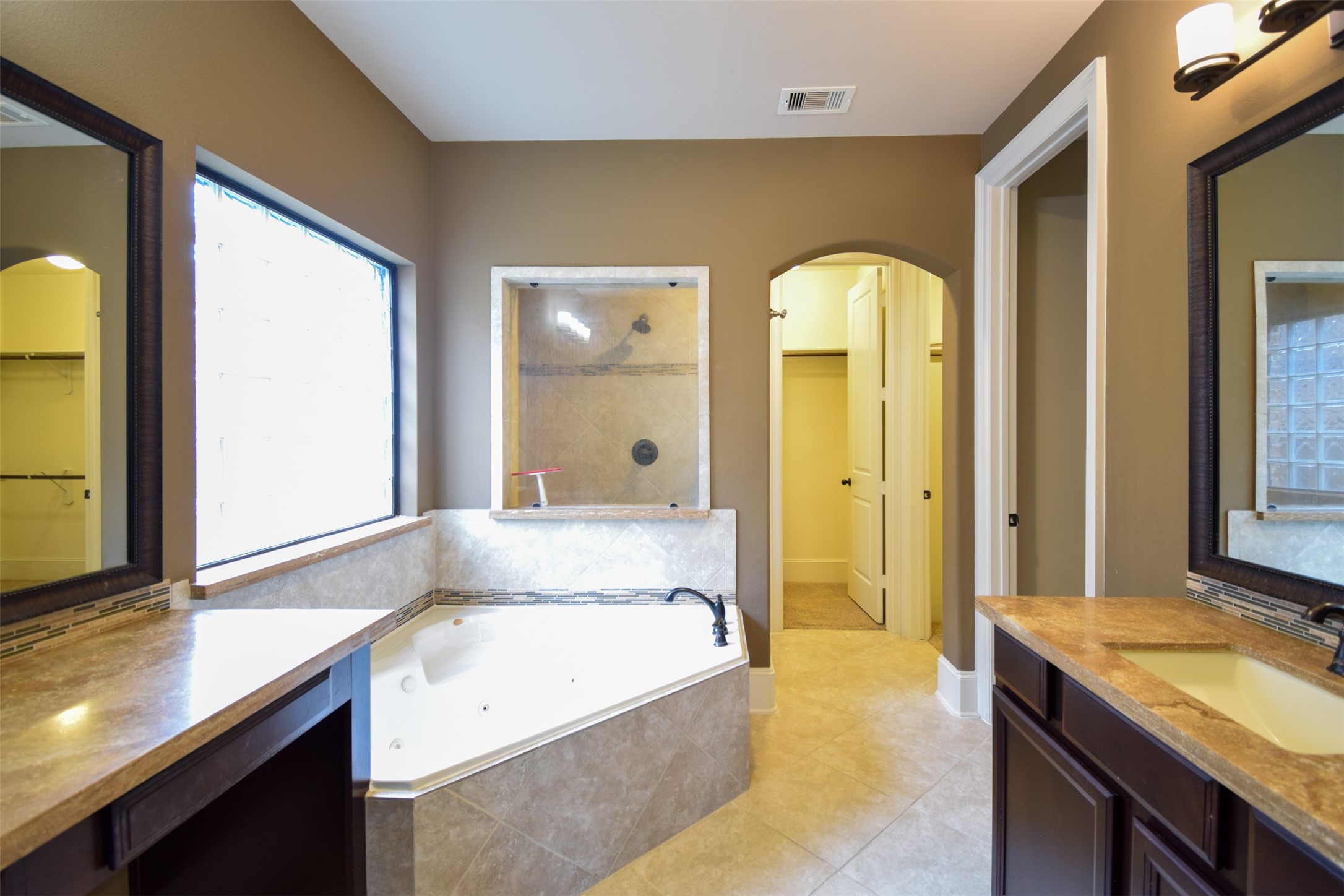 27363 Pendleton Trace Drive Spring, TX 77386 - Photo 11 of 26 a bathroom with a granite countertop sink and a mirror