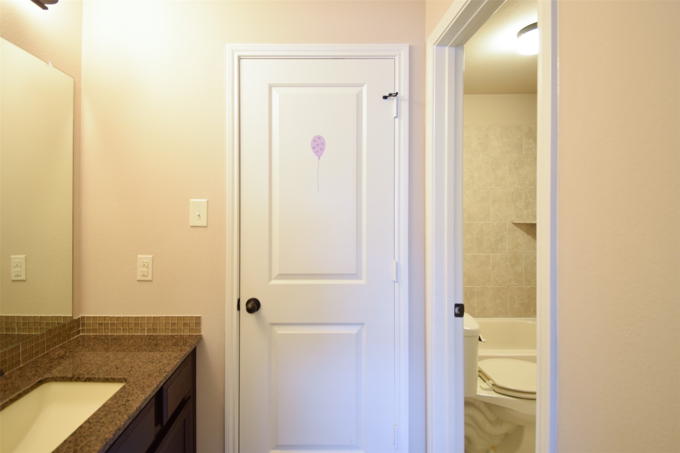 27363 Pendleton Trace Drive Spring, TX 77386 - Photo 21 of 26 a bathroom with a granite countertop sink and a mirror