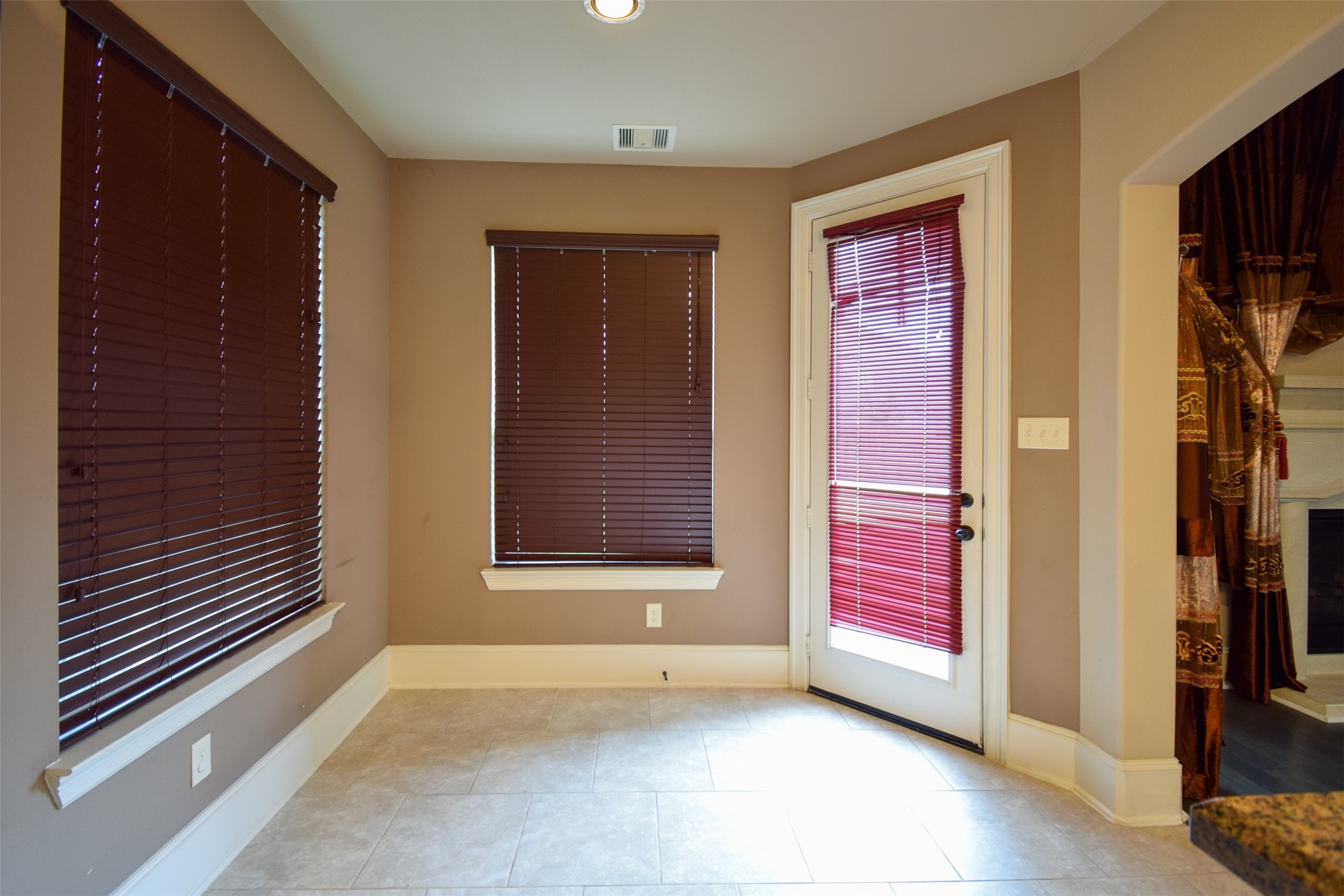 27363 Pendleton Trace Drive Spring, TX 77386 - Photo 8 of 26 a view of an empty room with wooden floor and a window