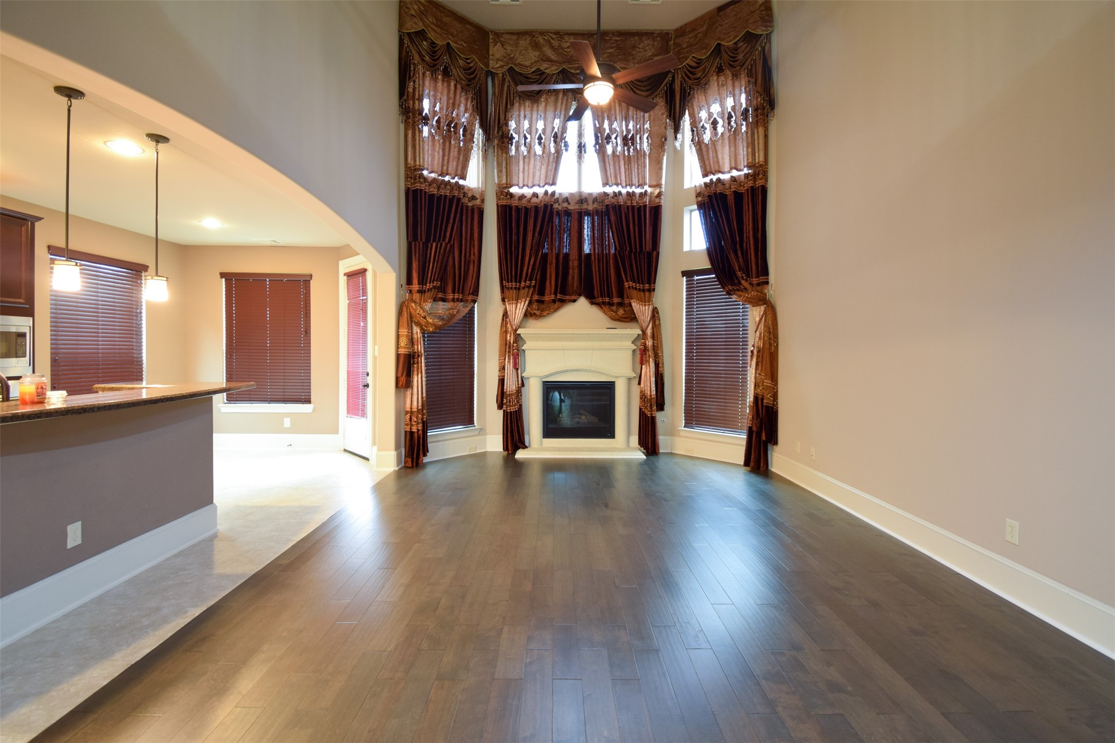 27363 Pendleton Trace Drive Spring, TX 77386 - Photo 9 of 26 a view of a hallway with wooden floor and chandelier