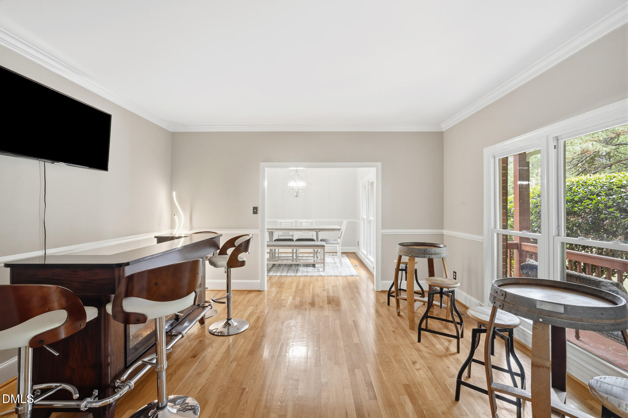 3735 Stoneybrook Drive Durham, NC 27705 - Photo 15 of 44 a view of a dining room with furniture and wooden floor