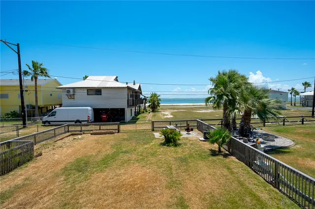 a room with furniture and a potted plant