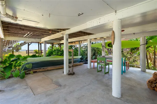a view of a porch with furniture and garden