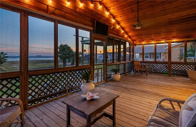 a view of a roof deck with wooden floor