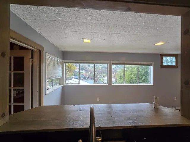 a view of an empty room and window