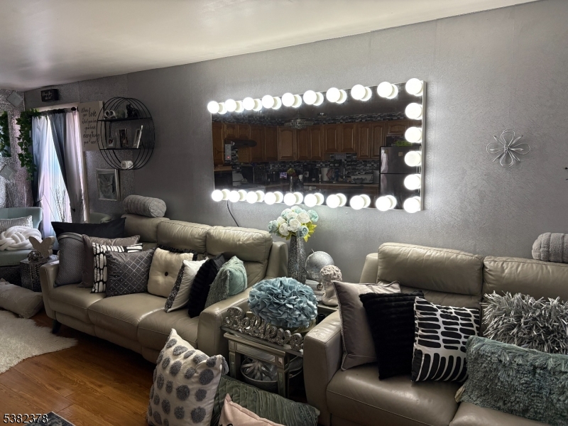 49 Hope Street Passaic, NJ 07055 - Photo 3 of 9 a living room with furniture and a large window