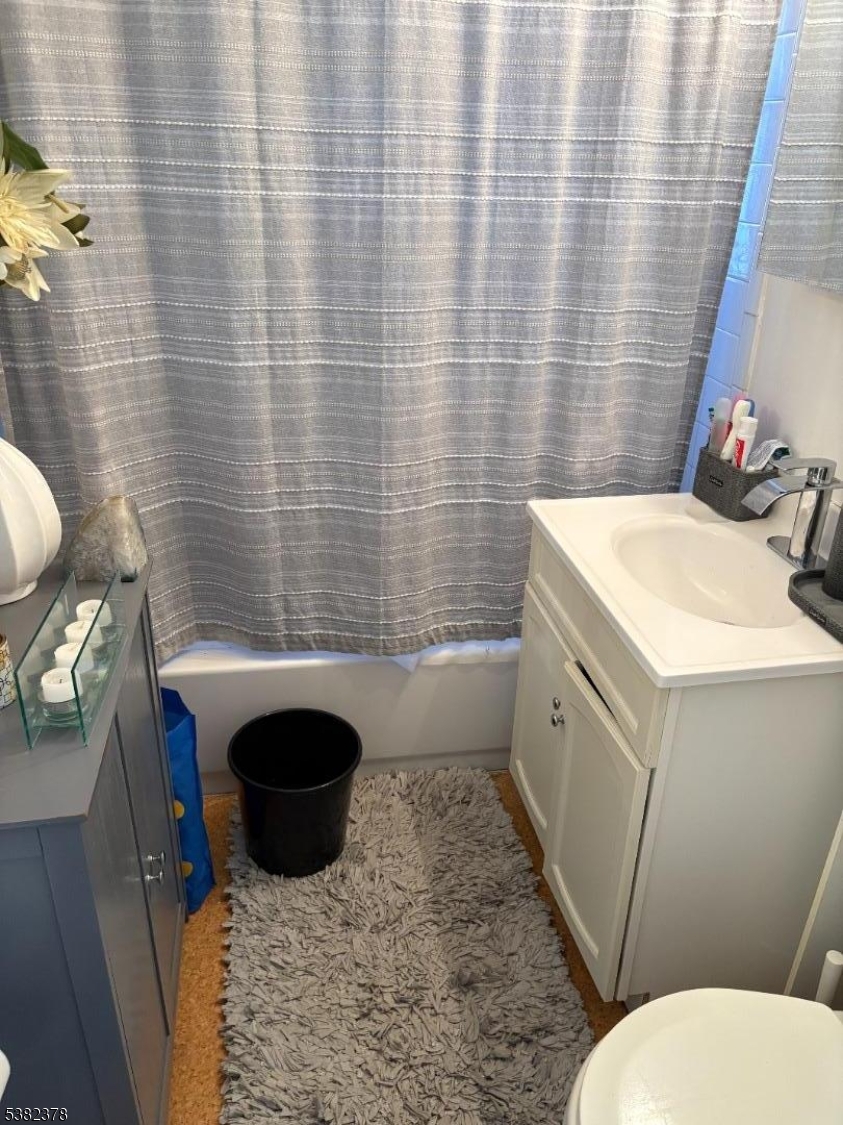 49 Hope Street Passaic, NJ 07055 - Photo 6 of 9 a bathroom with a sink toilet and shower