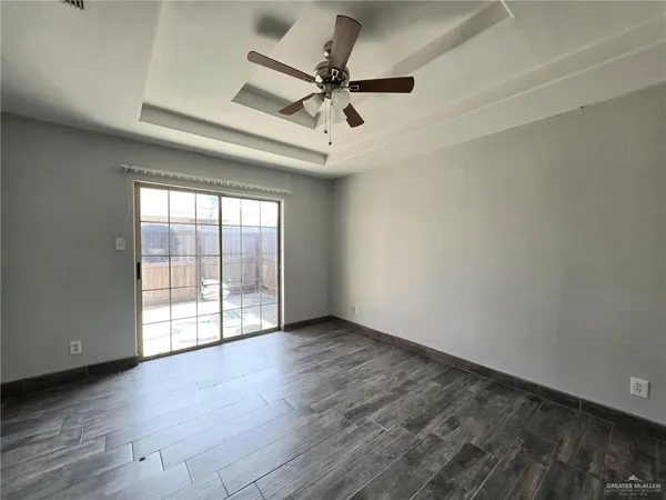 a view of an empty room with a window