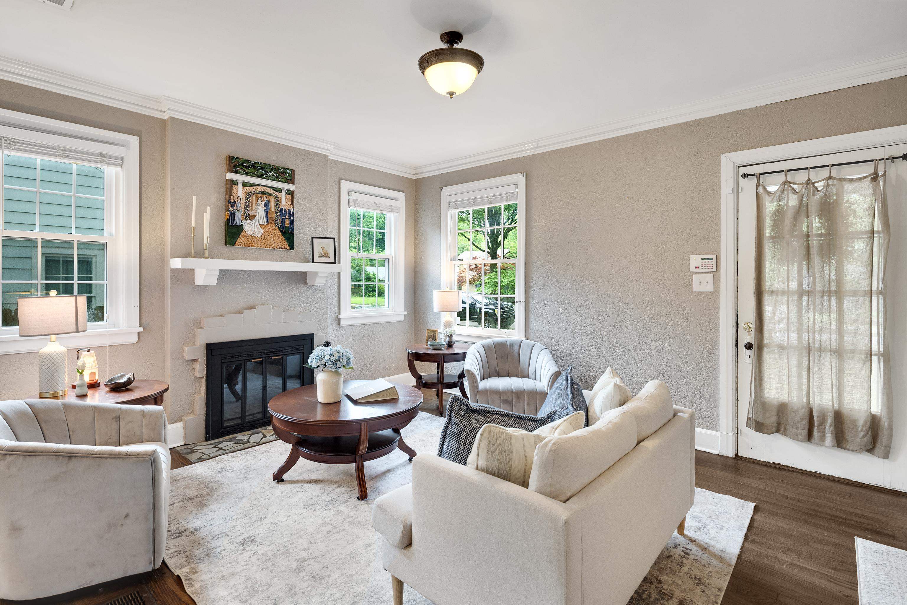 555 South Holmes Street Memphis, TN 38111 - Photo 5 of 40 a living room with furniture a fireplace and a large window