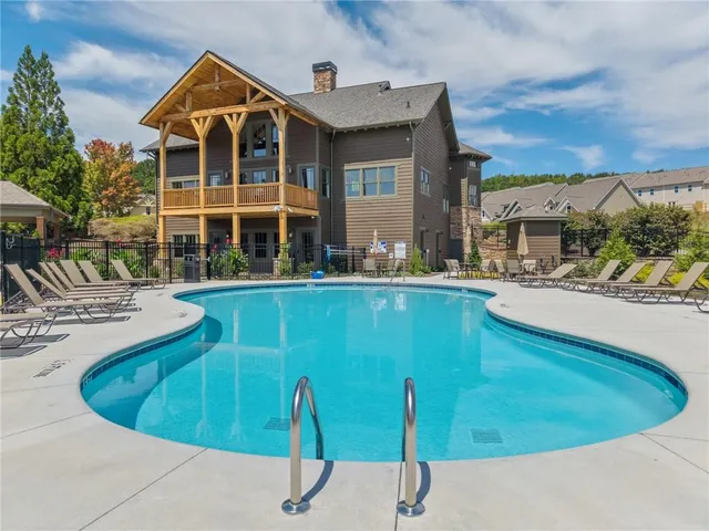 a view of a swimming pool with a lounge chairs