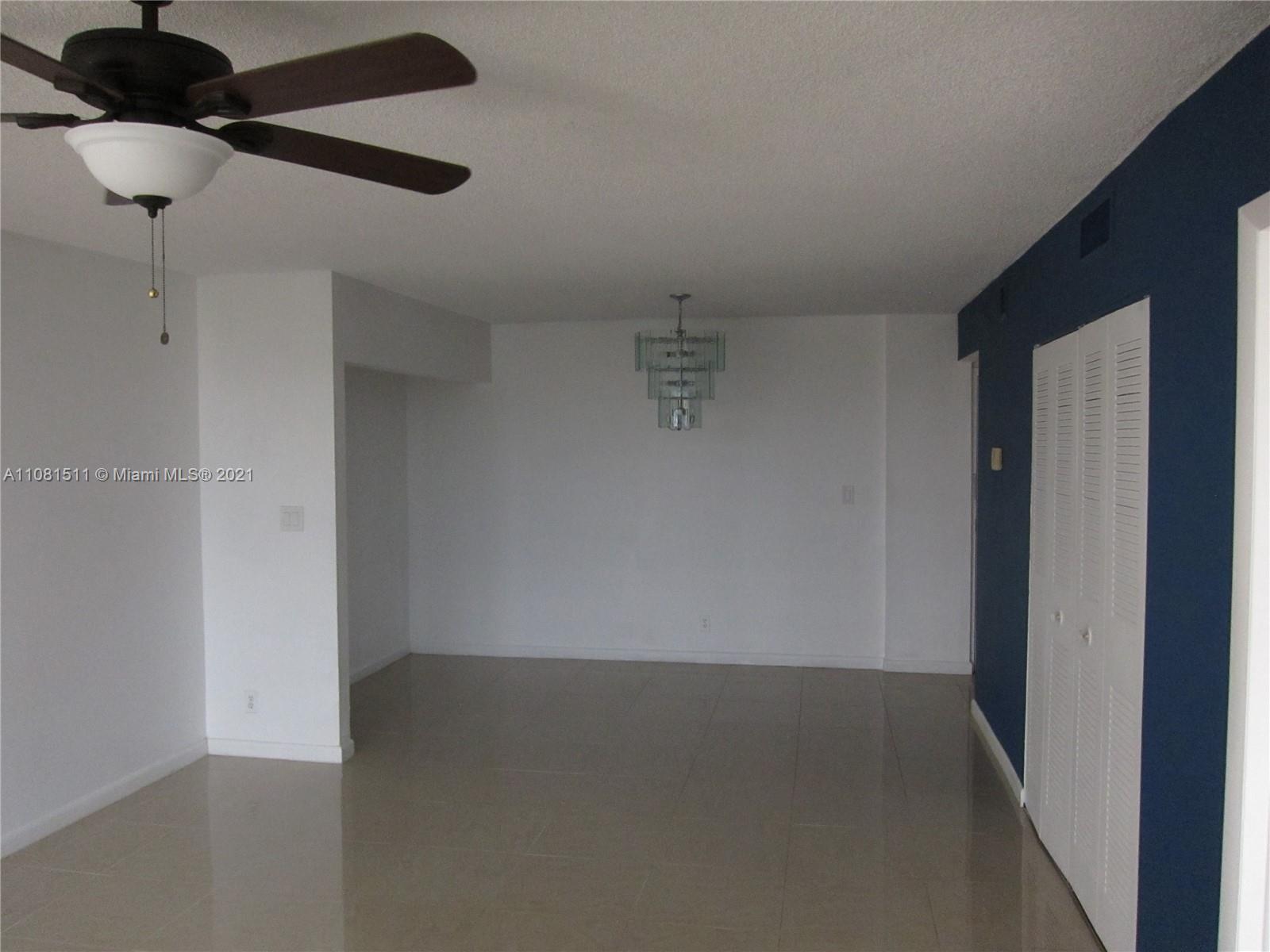 4222 Inverrary Boulevard, Unit 4702 Lauderhill, FL 33319 - Photo 3 of 10 a view of room with a ceiling fan