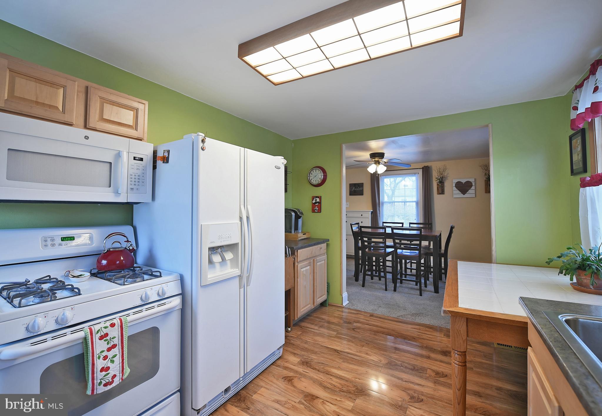 2011 Oakland Road Baltimore, MD 21220 - Photo 10 of 33 Kitchen off of DR w lam wood floors