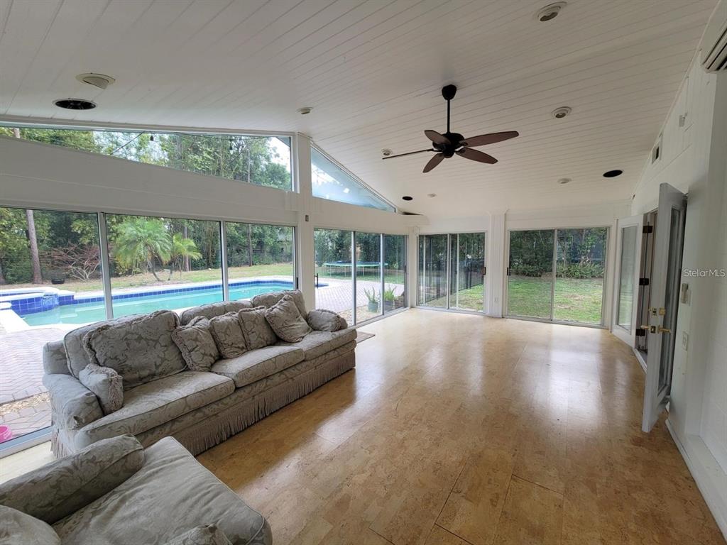 11129 Lake Butler Boulevard Windermere, FL 34786 - Photo 12 of 17 a living room with furniture and a large window