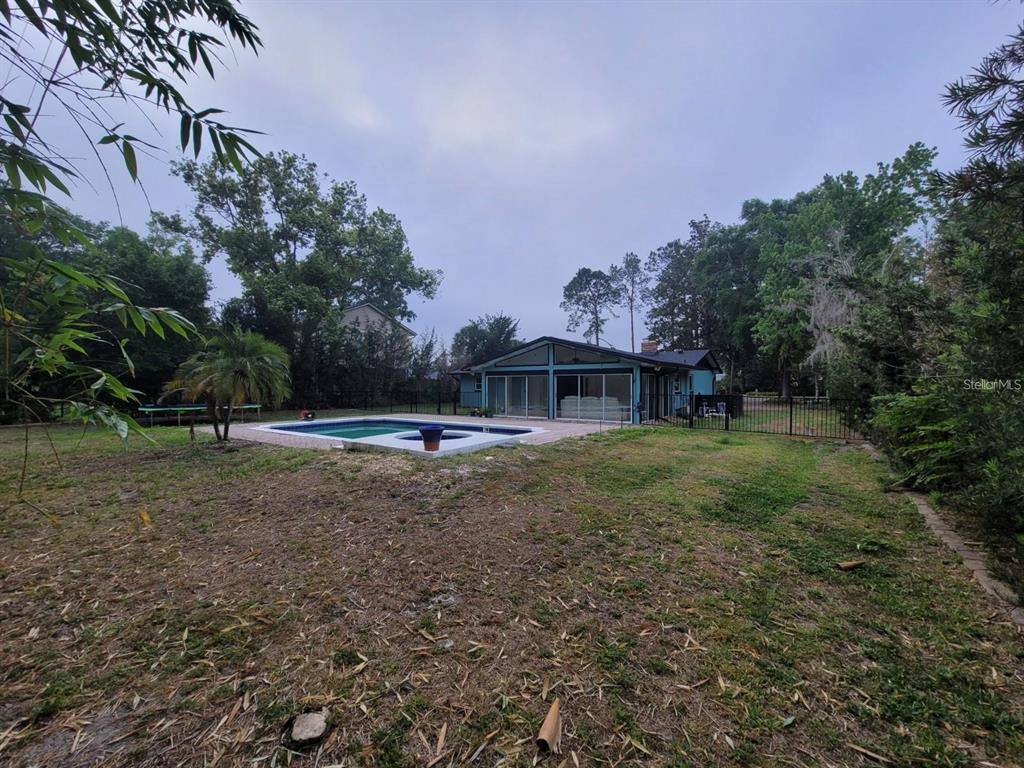 11129 Lake Butler Boulevard Windermere, FL 34786 - Photo 13 of 17 a view of a house with a yard