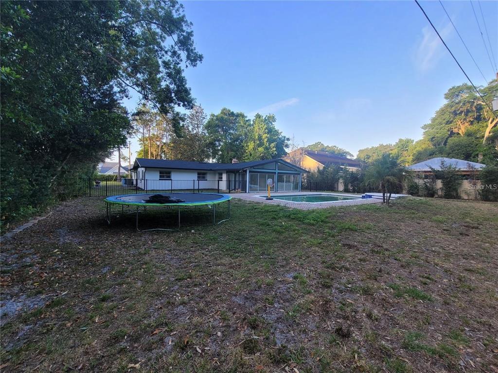 11129 Lake Butler Boulevard Windermere, FL 34786 - Photo 14 of 17 a view of a house with a backyard