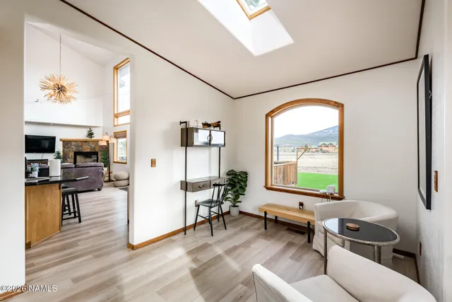 a kitchen with stainless steel appliances granite countertop a sink a stove and a refrigerator