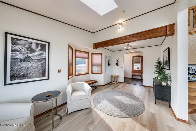 a kitchen with stainless steel appliances granite countertop a sink refrigerator and cabinets
