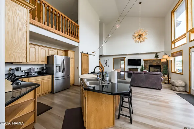 a kitchen with a stove and a refrigerator