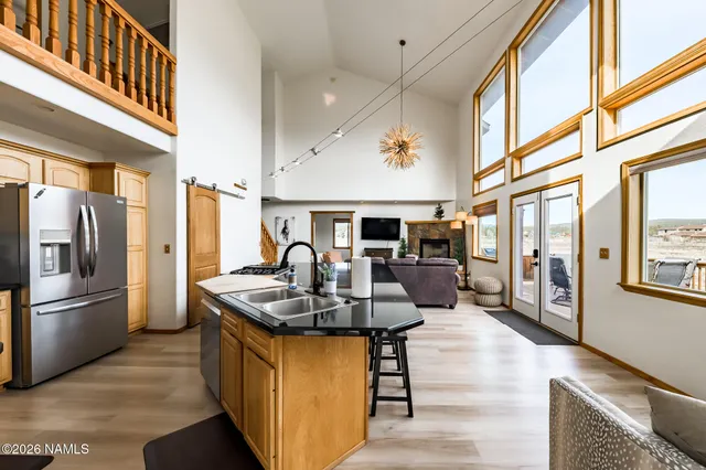 a kitchen with stainless steel appliances a stove and a refrigerator