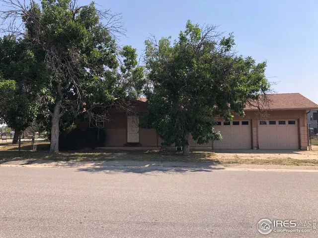 a house with trees in front of it