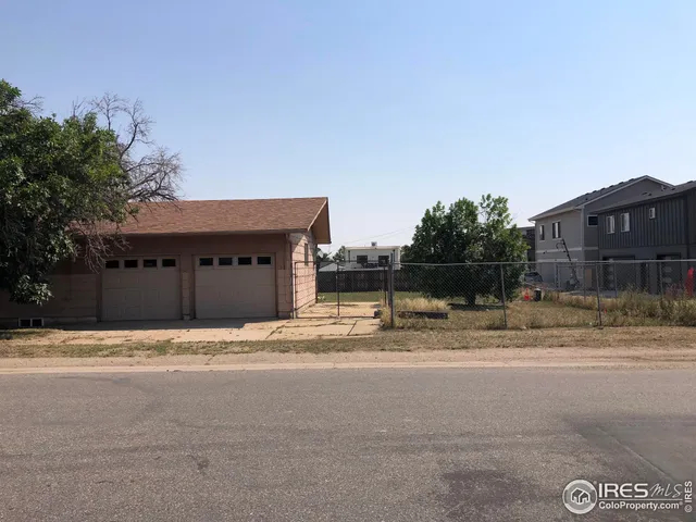 a house with a yard and a garage