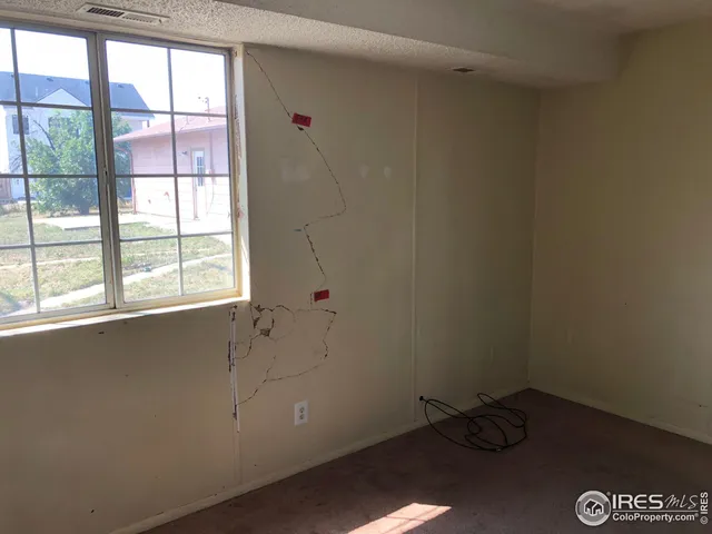 a kitchen with a refrigerator sink and cabinets
