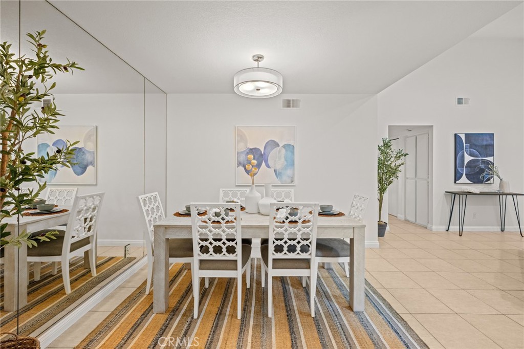 34004 Selva Road, Unit 377 Dana Point, CA 92629 - Photo 13 of 38 a view of a dining room with furniture and wooden floor