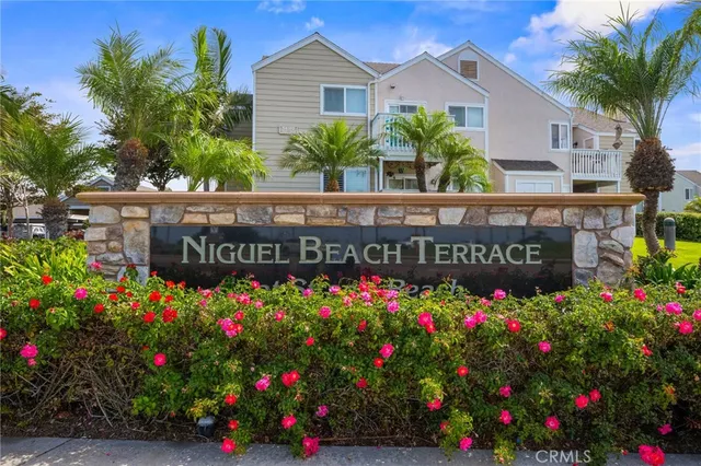 a view of a swimming pool with a lawn chairs