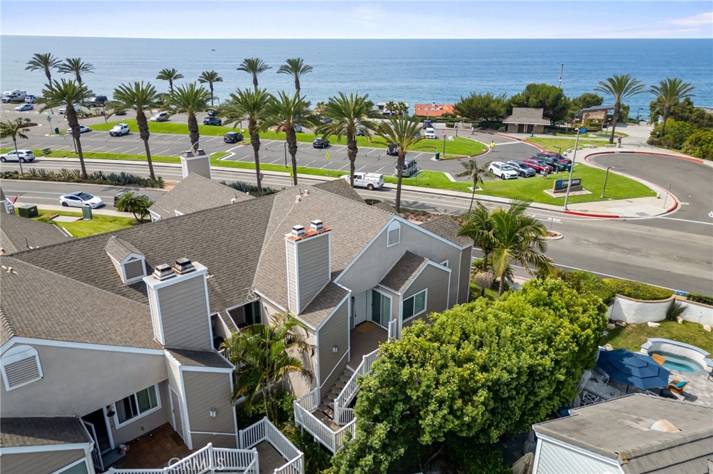 34004 Selva Road, Unit 377 Dana Point, CA 92629 - Photo 28 of 38 a view of a swimming pool with a lawn chairs