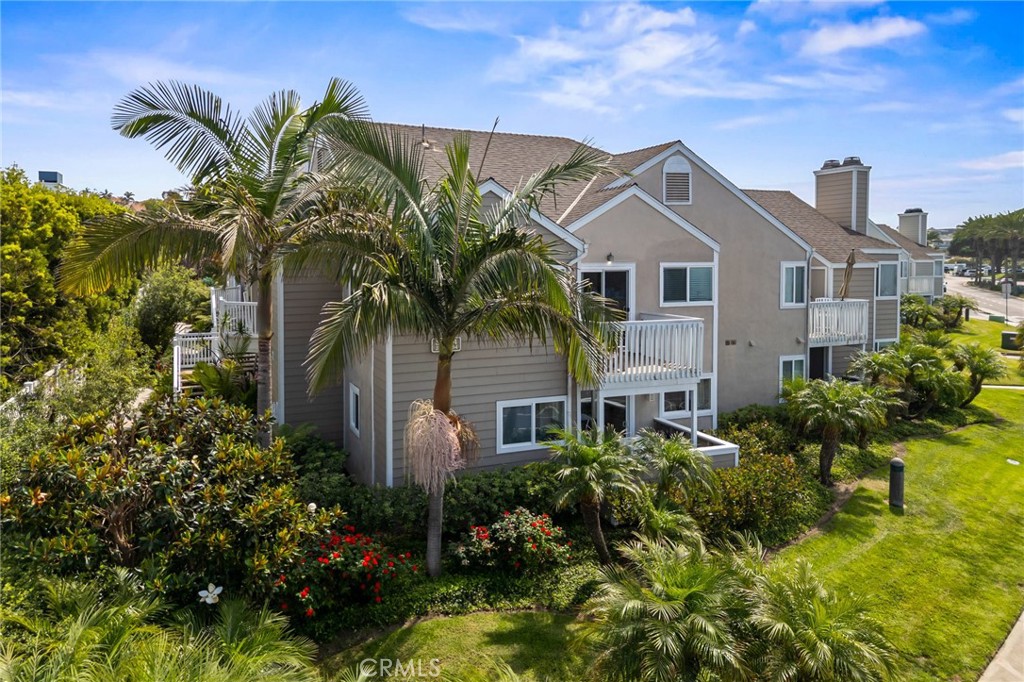 34004 Selva Road, Unit 377 Dana Point, CA 92629 - Photo 30 of 38 a front view of a house with a garden
