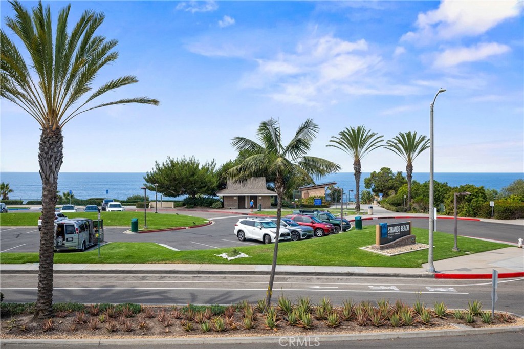 34004 Selva Road, Unit 377 Dana Point, CA 92629 - Photo 3 of 38 a view of a yard with cars parked