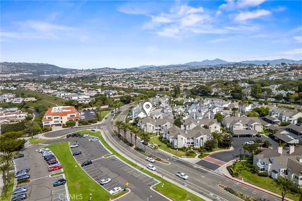 an aerial view of residential building with an outdoor space
