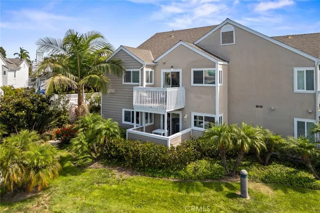 an aerial view of multiple houses with yard