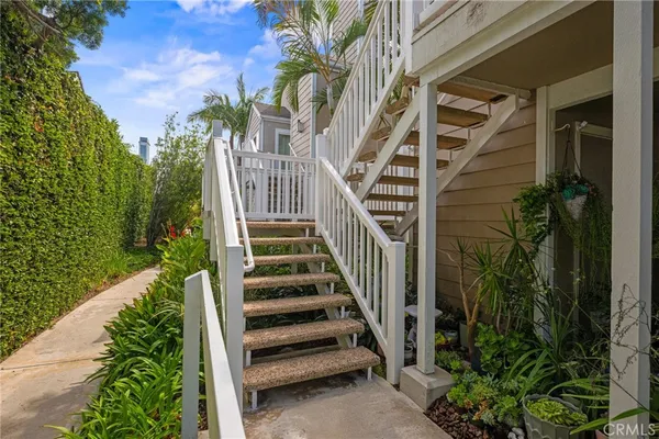 a view of a house with a yard corridor and stairs