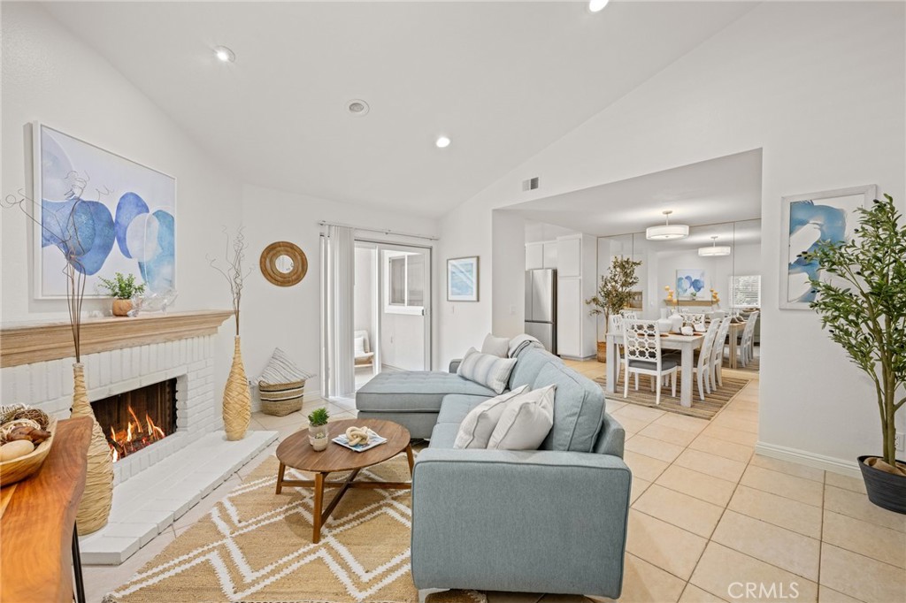 34004 Selva Road, Unit 377 Dana Point, CA 92629 - Photo 6 of 38 a living room with furniture and a fireplace