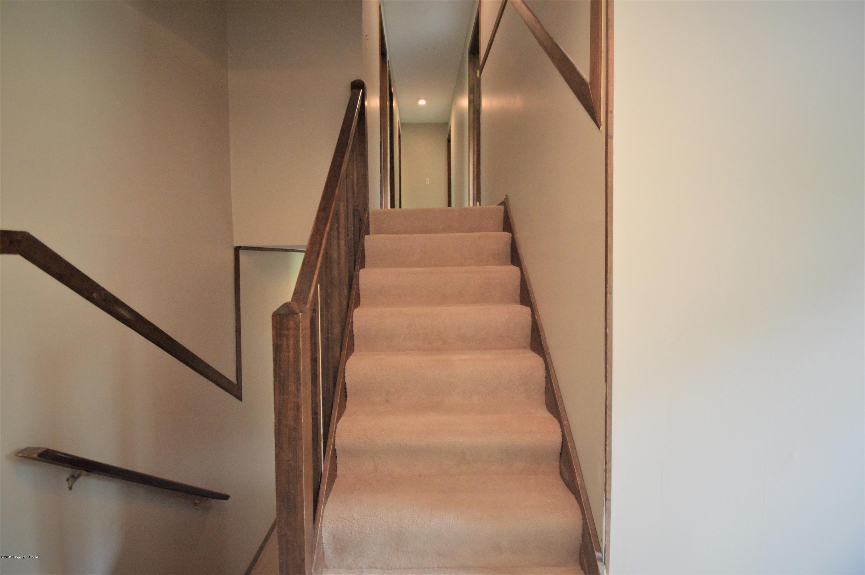 739 Snow Hill Road Cresco, PA 18326 - Photo 12 of 18 Stairs to upper level