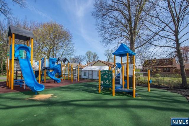 153 Madison Avenue Rochelle Park, NJ 07662 - Photo 11 of 26 a view of a park with slide and a bench