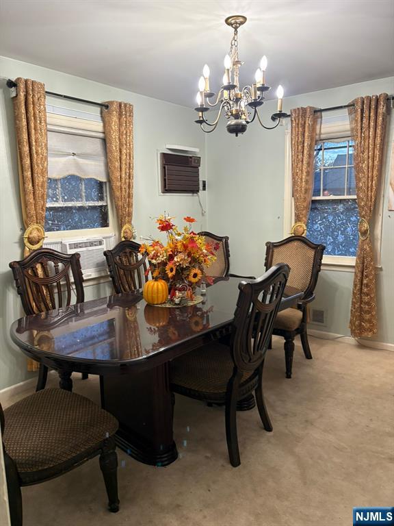 153 Madison Avenue Rochelle Park, NJ 07662 - Photo 17 of 26 a view of a dining room with furniture and a chandelier
