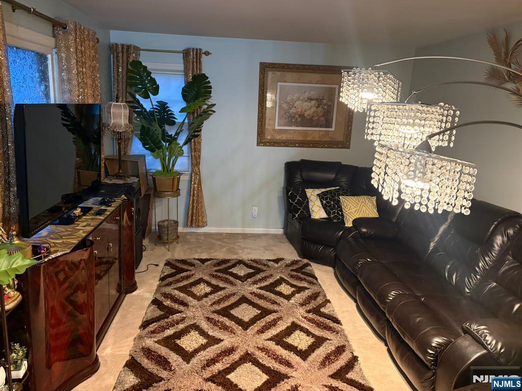 153 Madison Avenue Rochelle Park, NJ 07662 - Photo 18 of 26 a bedroom with a bed and a flat screen tv