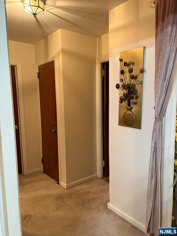 153 Madison Avenue Rochelle Park, NJ 07662 - Photo 21 of 26 a view of a hallway with closet and front door