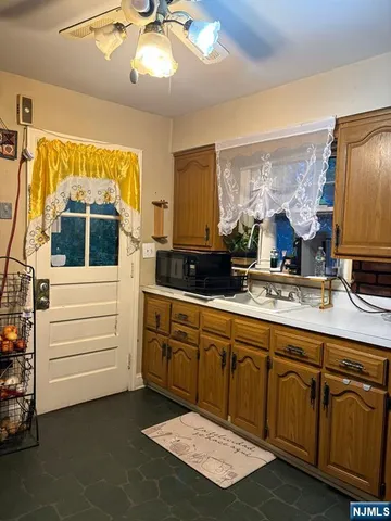 a kitchen with stainless steel appliances granite countertop a stove and a sink