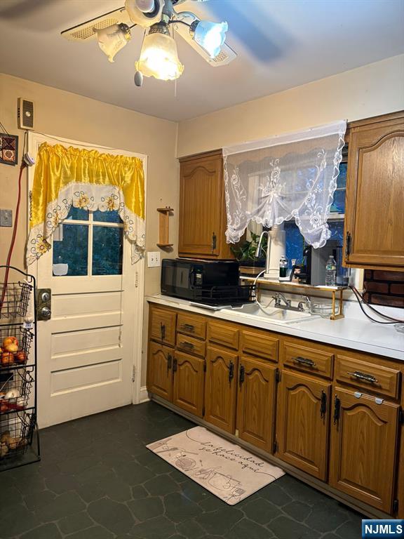 153 Madison Avenue Rochelle Park, NJ 07662 - Photo 22 of 26 a kitchen with a sink and cabinets