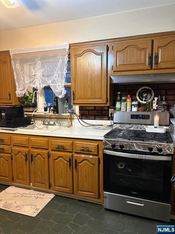 153 Madison Avenue Rochelle Park, NJ 07662 - Photo 23 of 26 a kitchen with stainless steel appliances granite countertop a stove and a sink