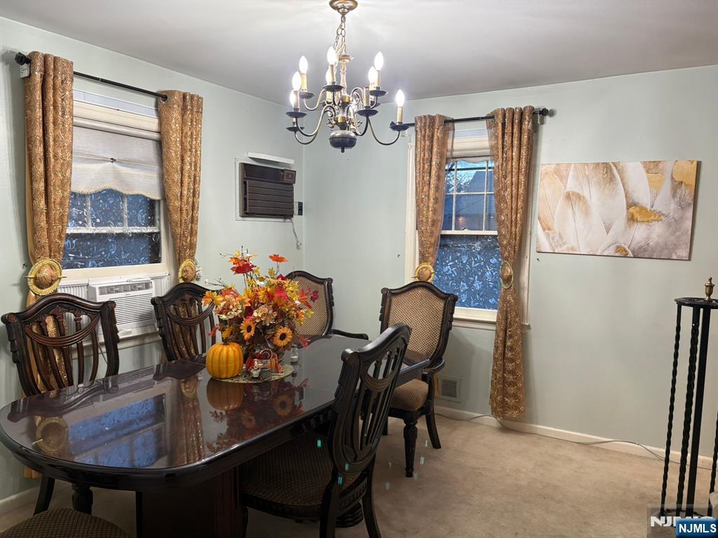 153 Madison Avenue Rochelle Park, NJ 07662 - Photo 4 of 26 a view of a dining room with furniture a chandelier and window