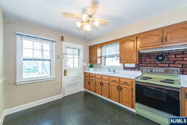 153 Madison Avenue Rochelle Park, NJ 07662 - Photo 7 of 26 a open kitchen with stainless steel appliances granite countertop a stove and a sink
